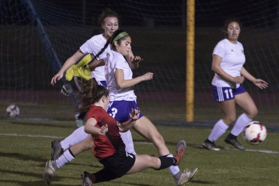 Lemoore's Roxana Ortiz contends with a Hanford player in Tuesday's 3-0 win over Hanford.